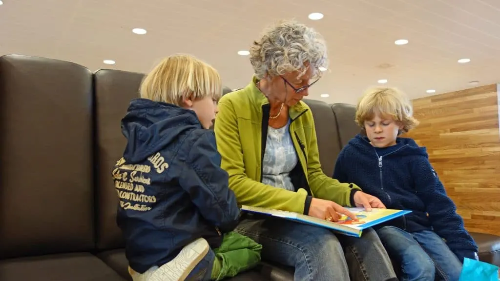 Grandma reading to kids