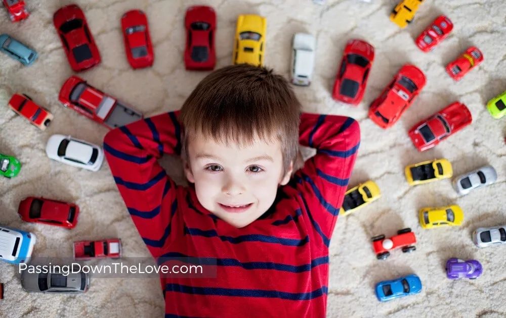 boy with toy cars