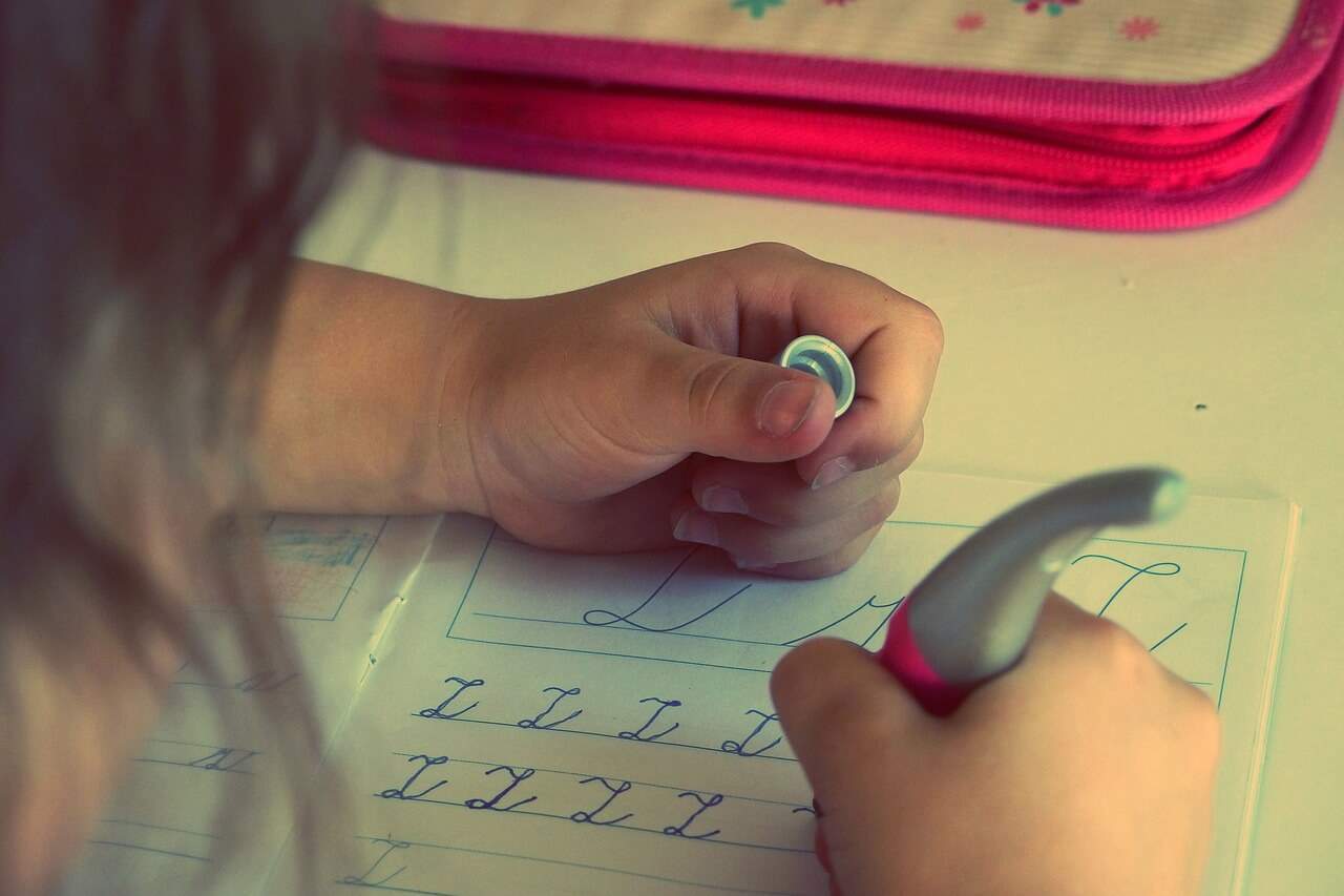 Child learning, writing