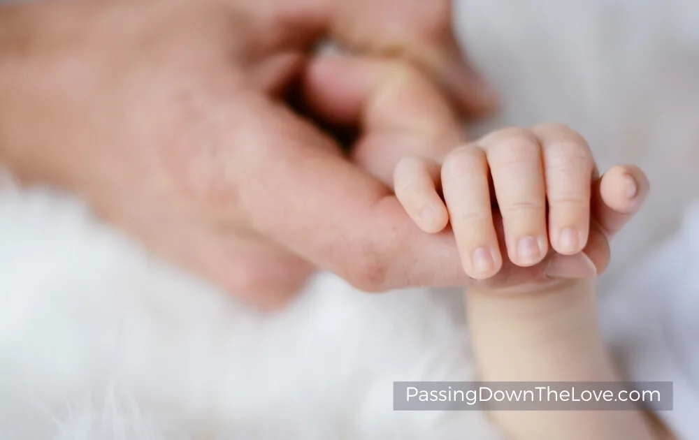 baby and mom hands