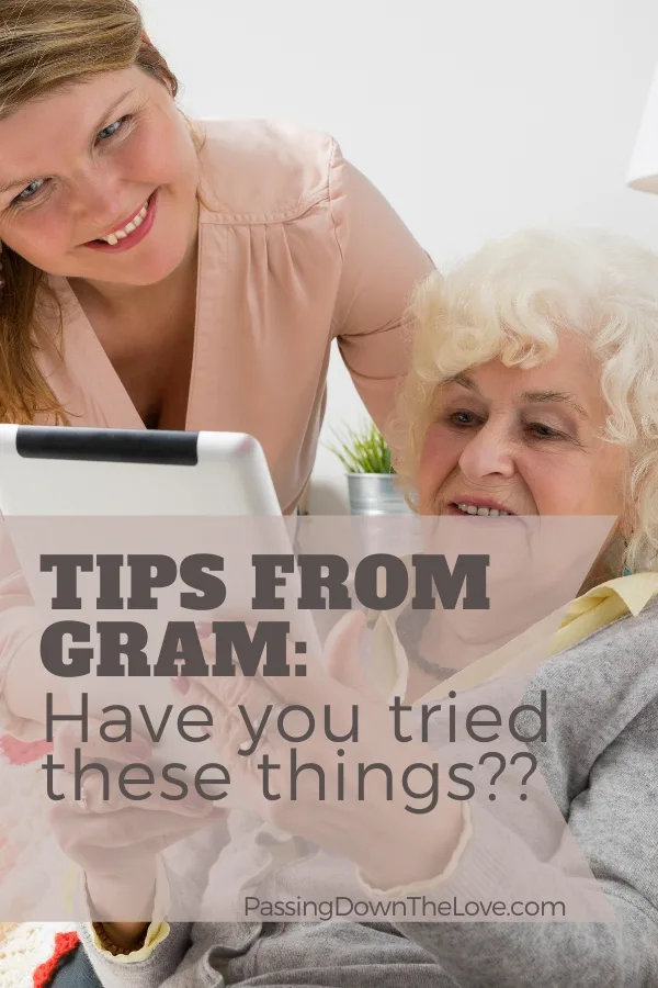 Grandma, granddaughter looking at tablet