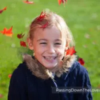 girl with falling leaves