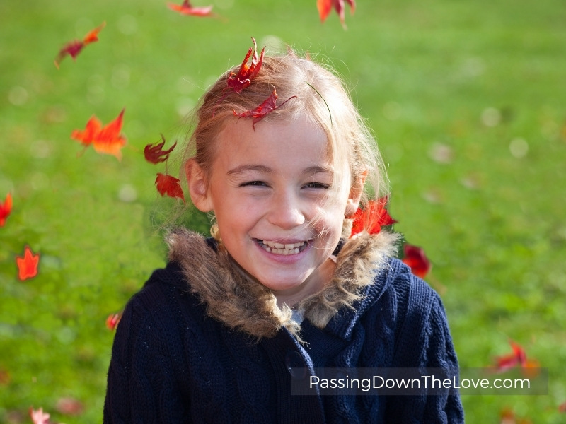 girl with falling leaves