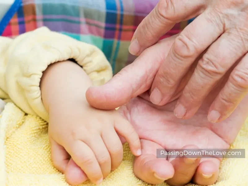 baby and grandparent hands