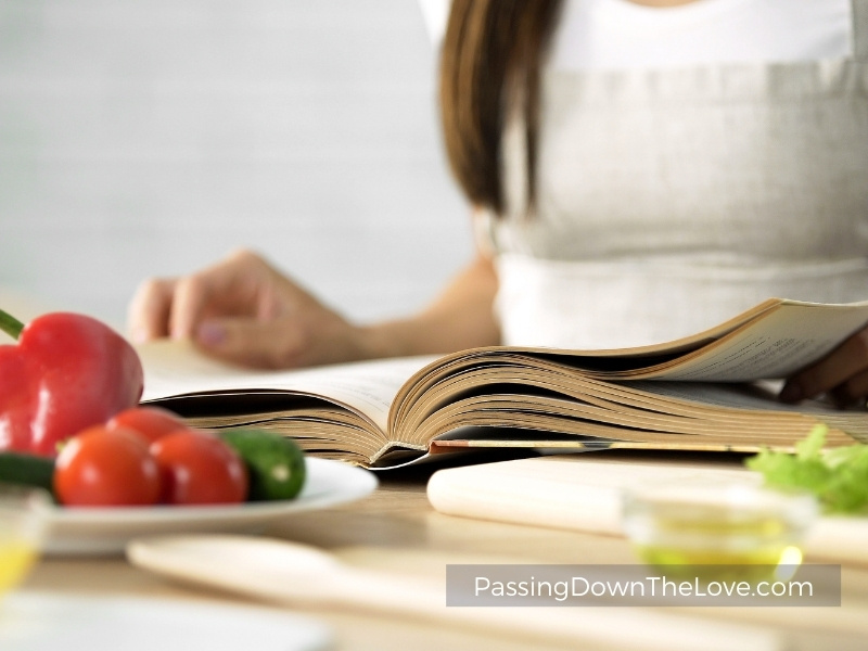 girl cooking with cookbook